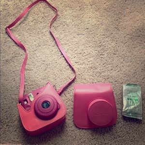 Pink Instax camera with case and pack of film